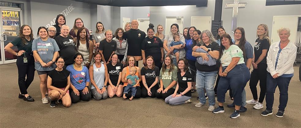 Womens Self Defense knee kicking a dummy