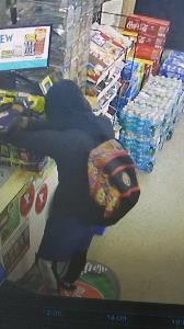 Armed robbery suspect with multi-colored backpack Armed robbery suspect with multi-colored backpack